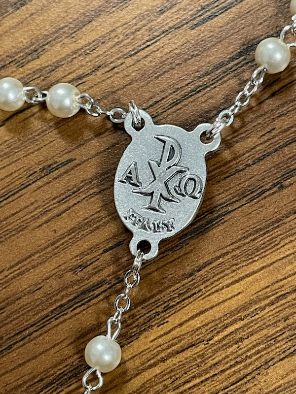 WHT PEARL ENAMEL CRUCIFIX COMM