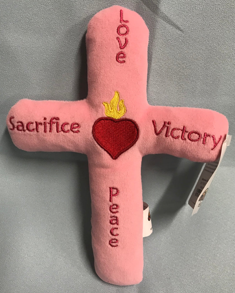 Pink plush toy cross.